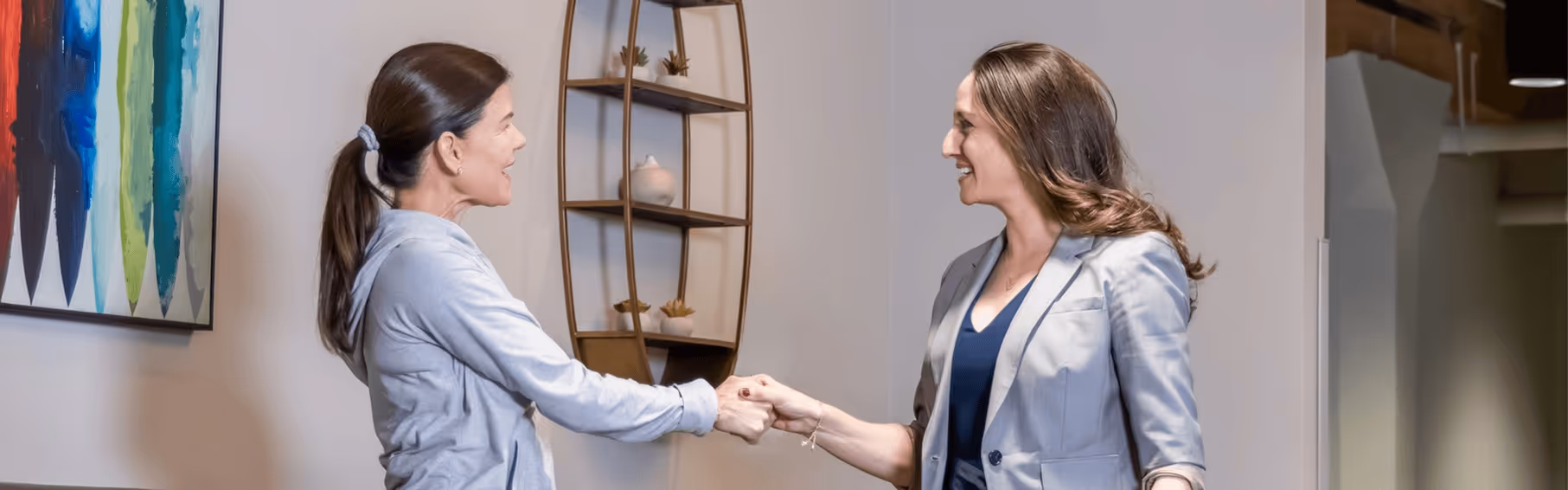 Dr. Jessica Benjamin greets a female patient, highlighting specialized care in Chicago for women in perimenopause and menopause