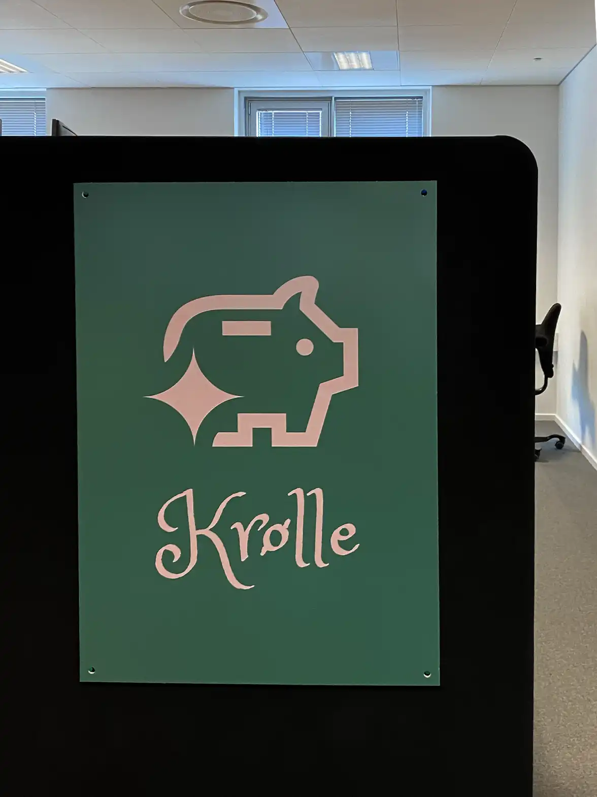 The pig Krølle in a poster in the office space.