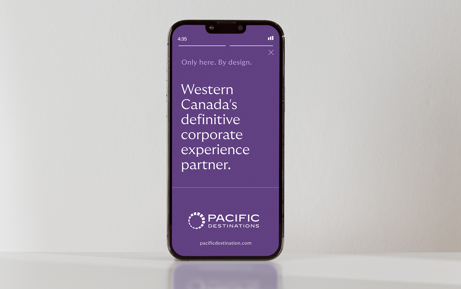 Phone screen showing purple ad for Western Canada's corporate experience partner, Pacific Destinations.