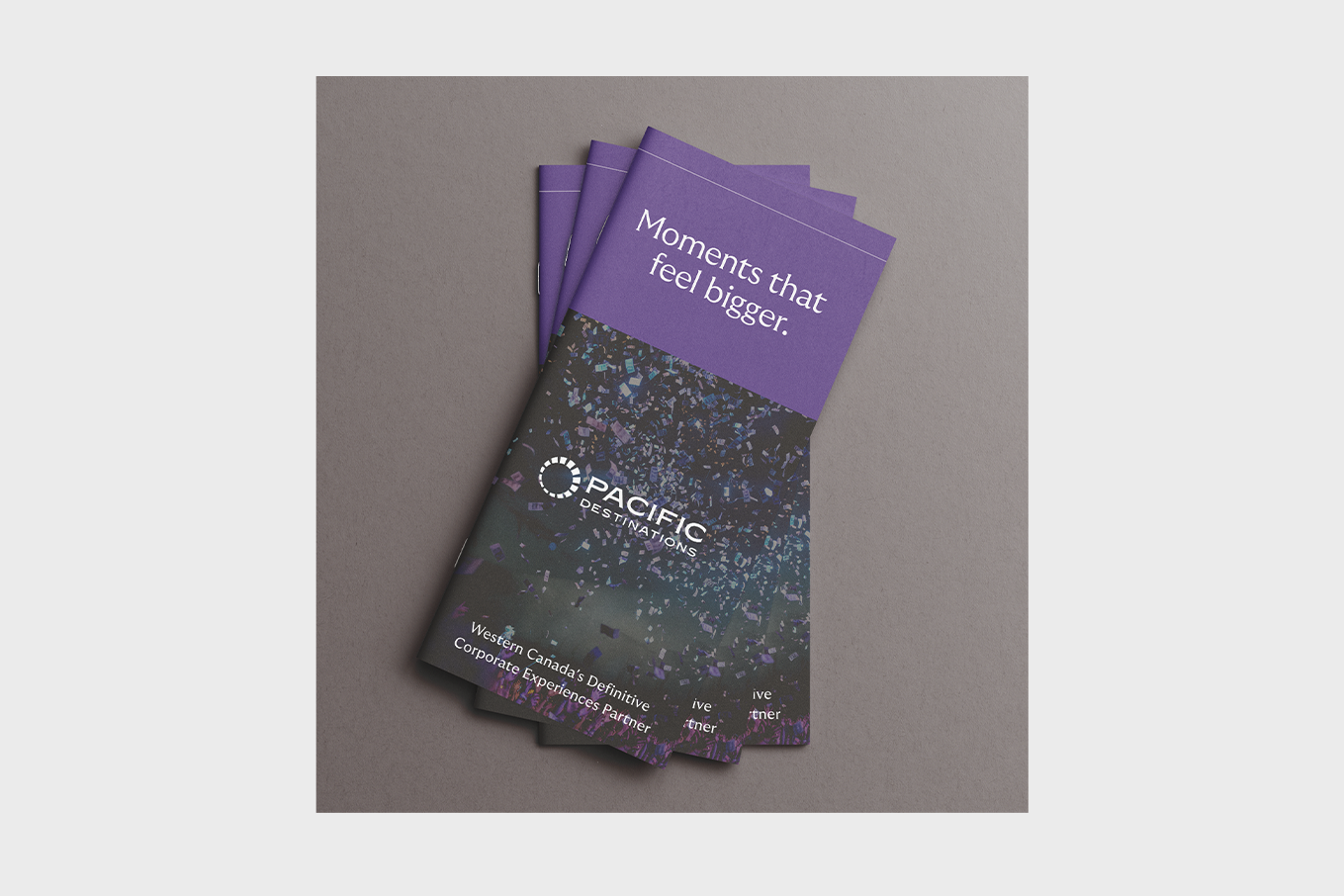 Brochures with purple top reading 'Moments that feel bigger' and Pacific Destinations logo on confetti background.