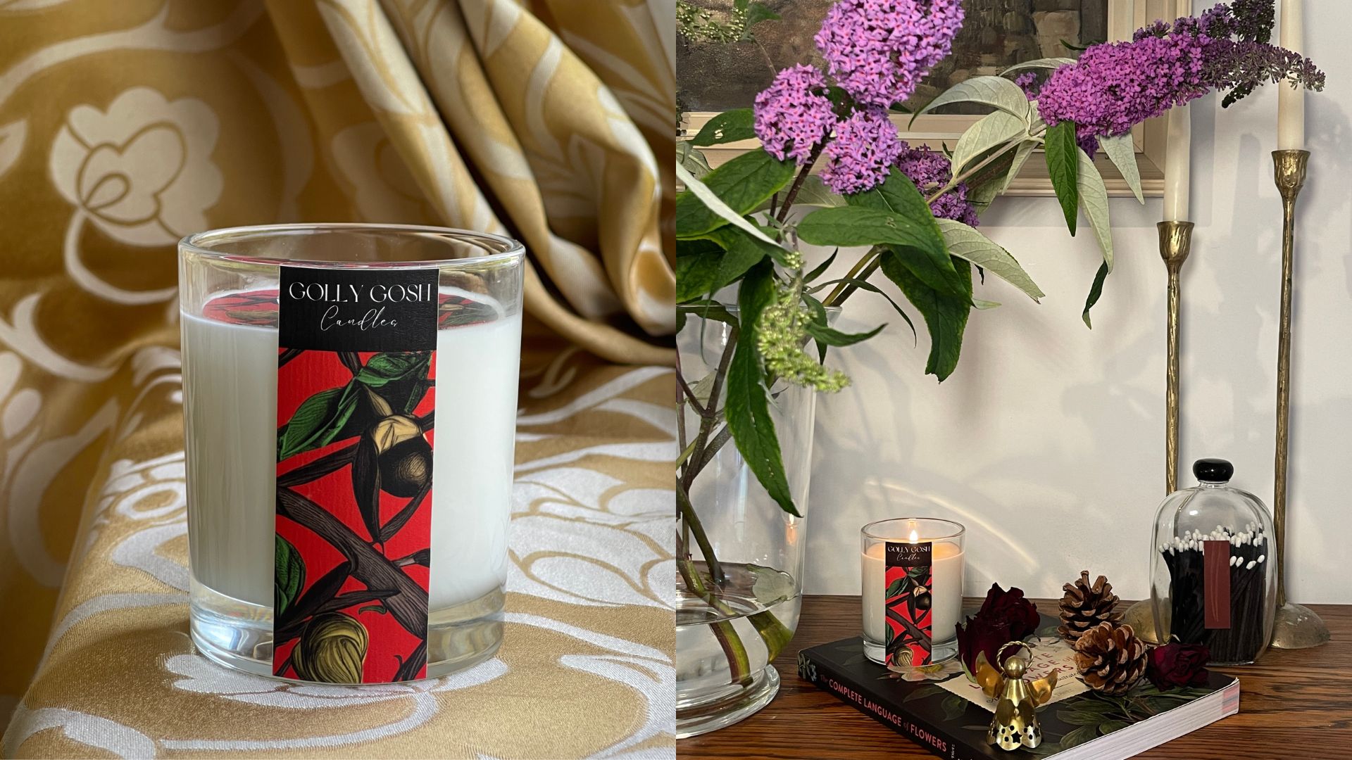 Hand-poured Golly Gosh Candles glass candle burning beside lilac flowers, brass candlesticks, pinecones, and books for an elegant home setting.