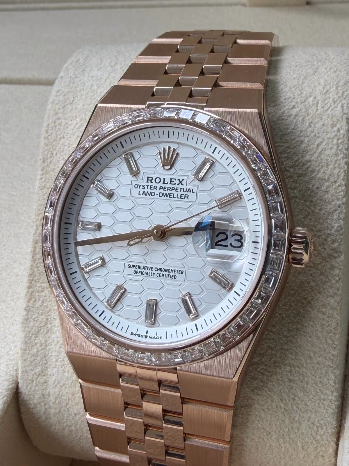 Side profile of the Rolex Land-Dweller 36 highlighting the diamond-set bezel and polished 18 ct Everose gold case.