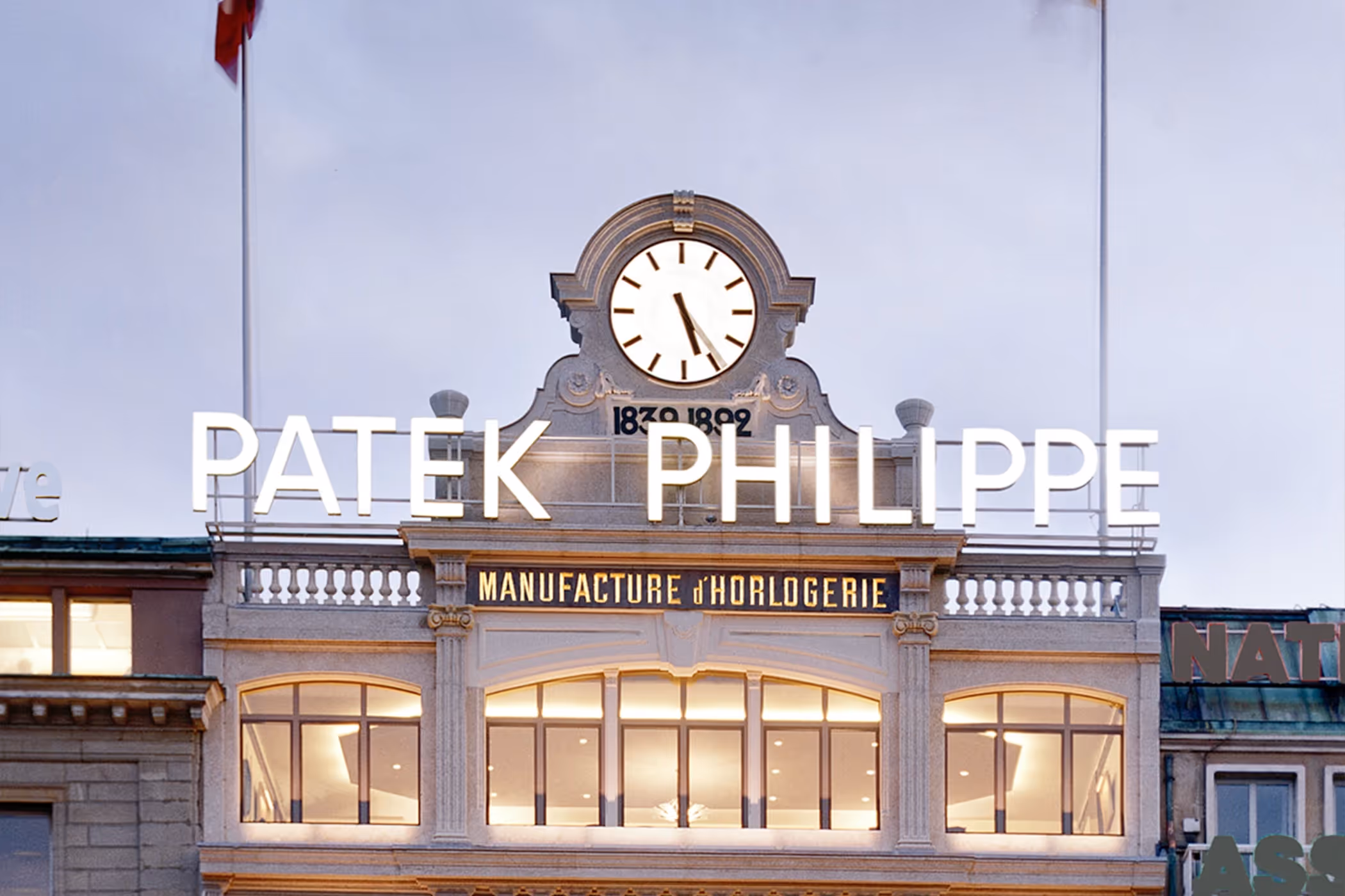 Exterior view of the Patek Philippe flagship boutique in Geneva with elegant store lighting.