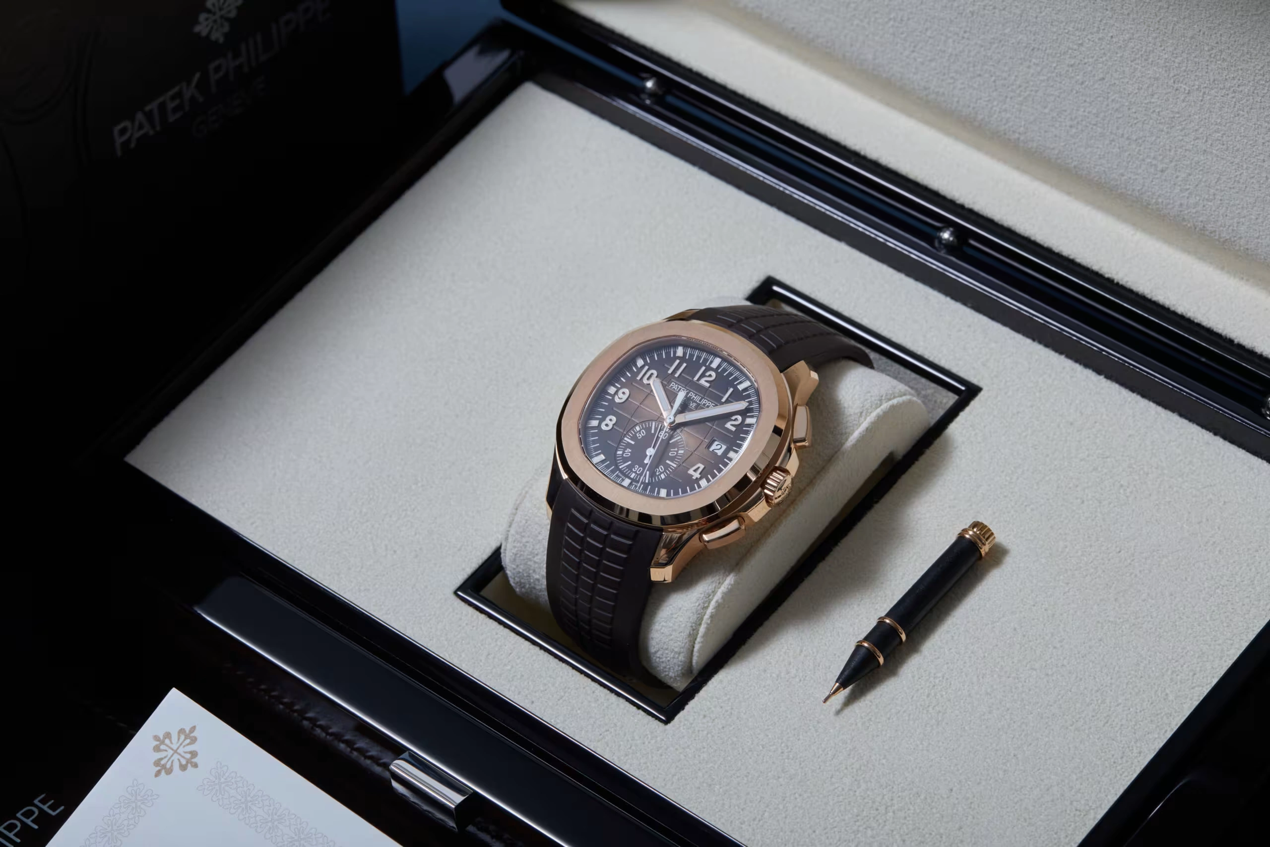Rose gold Patek Philippe Aquanaut 5968R with sunburst brown embossed dial and matching brown composite strap.