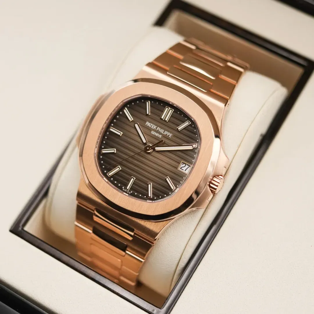 Discontinued Patek Philippe Nautilus 5711/1R in rose gold with a brown sunburst horizontal embossed dial.