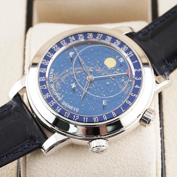 Luxury Patek Philippe 6102P Celestial Grand Complication watch presented on a cream leather cushion inside its original wooden display box, showing the sky-moon dial and black alligator strap.