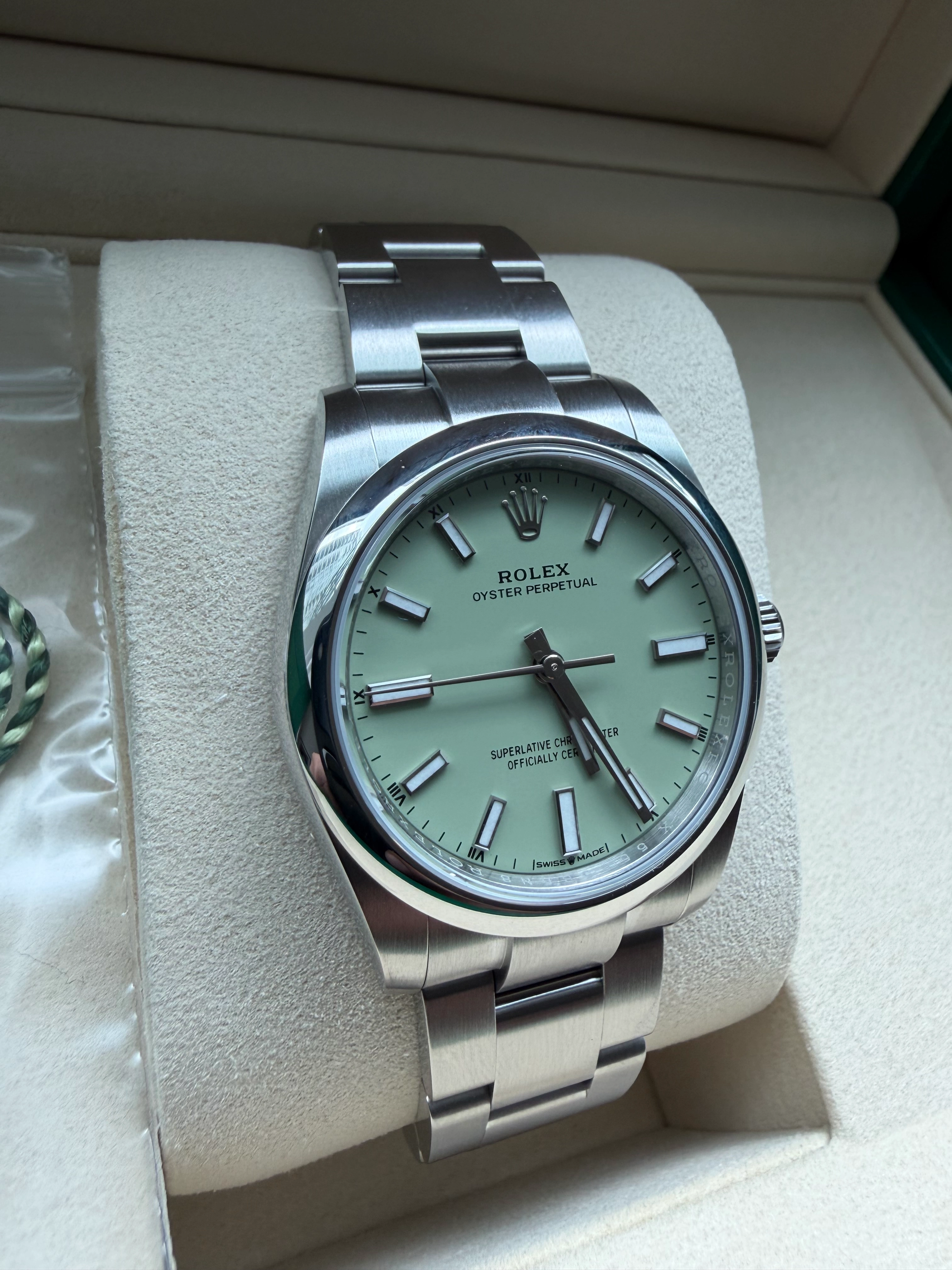 Side profile of the Rolex Oyster Perpetual 34mm showcasing the polished domed bezel.