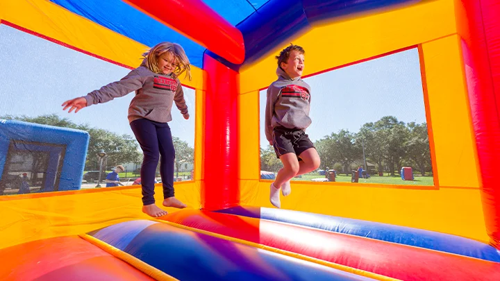 Rent a bounce house today with Freedom Fun USA. Perfect for a bounce house birthday party or school event.