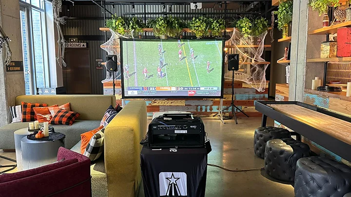 A backyard movie party with our basic outdoor inflatable movie screen rental package.