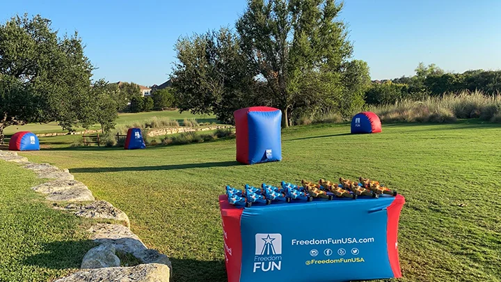 A complete nerf laser tag party rental package setup outdoors for a birthday party. Our mobile laser tag equipment rental packages are great for team builders, birthdays, school events & more.