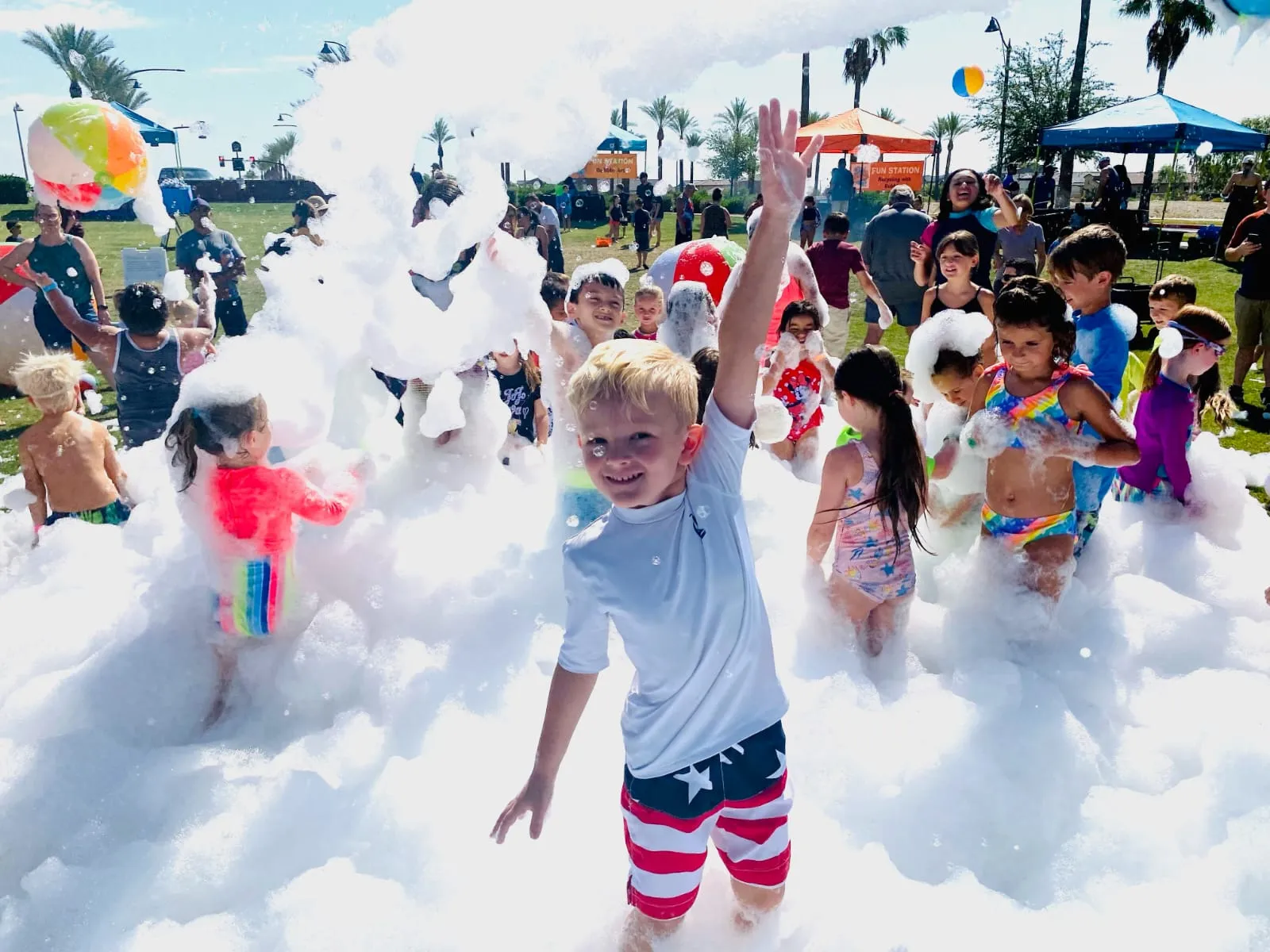 A family enjoying an outdoor foam party