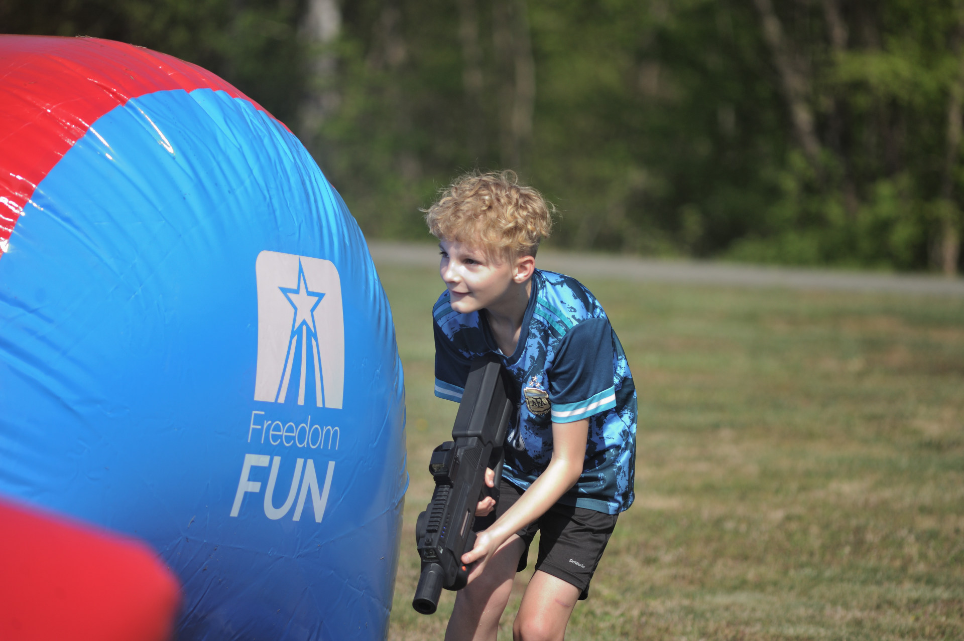 little boy playing mobile laser tag at freedom fun usa north carolina grand opening 