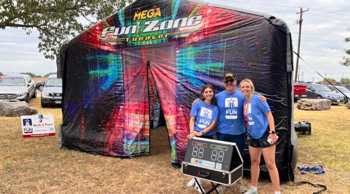 Interactive play system carnival game rental at a school event.