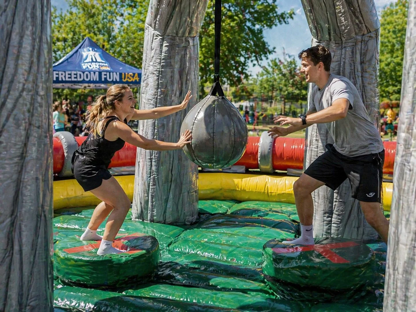 Giant inflatable wrecking ball rental at an event.