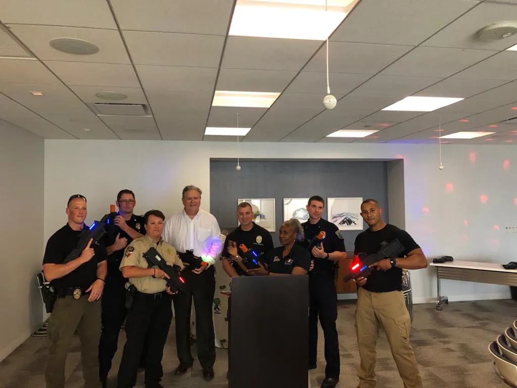 Law enforcement team training with Freedom Fun mobile laser tag equipment at corporate team-building event