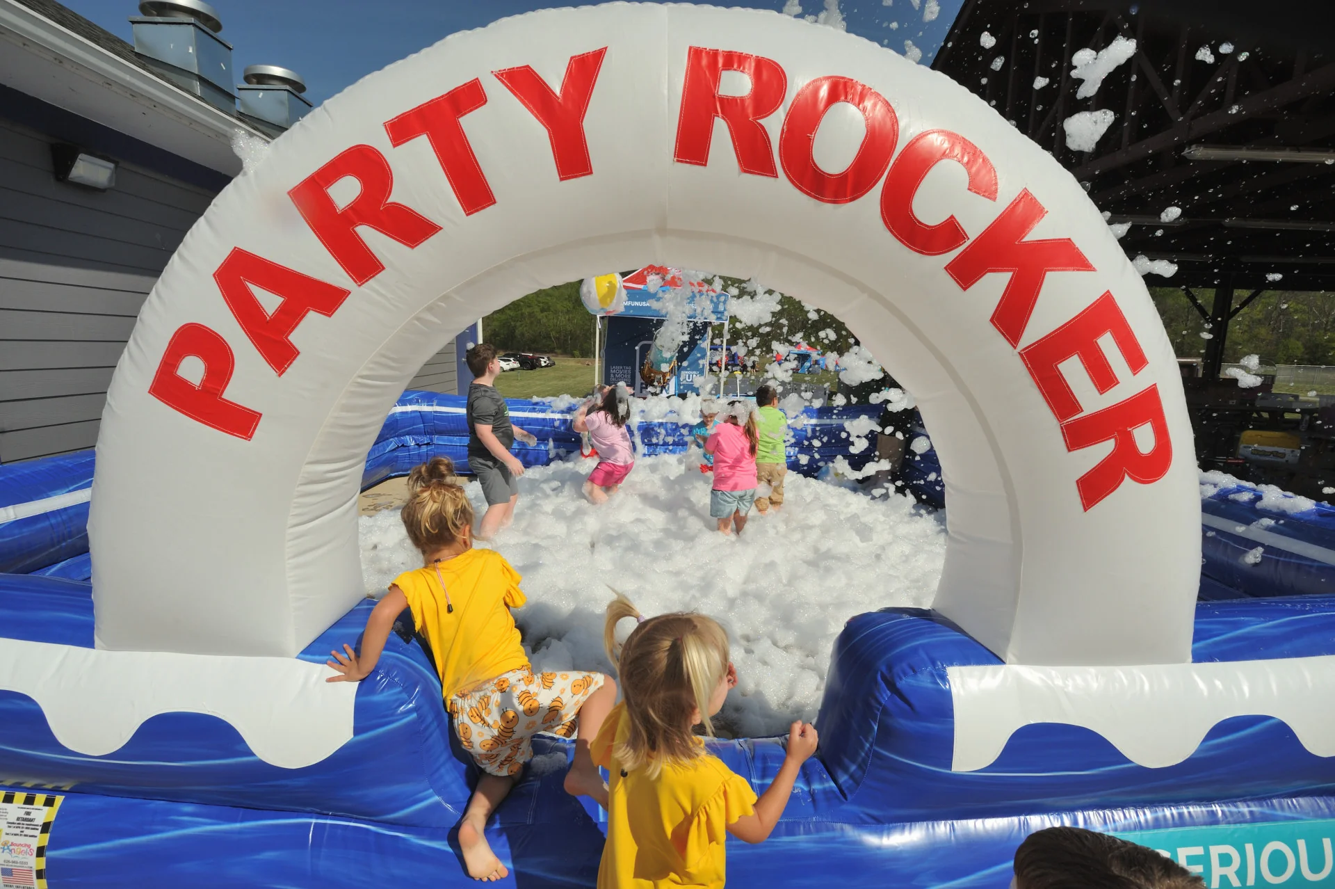 Kids holding Happy Birthday letters at a foam birthday party in Winston-Salem NC