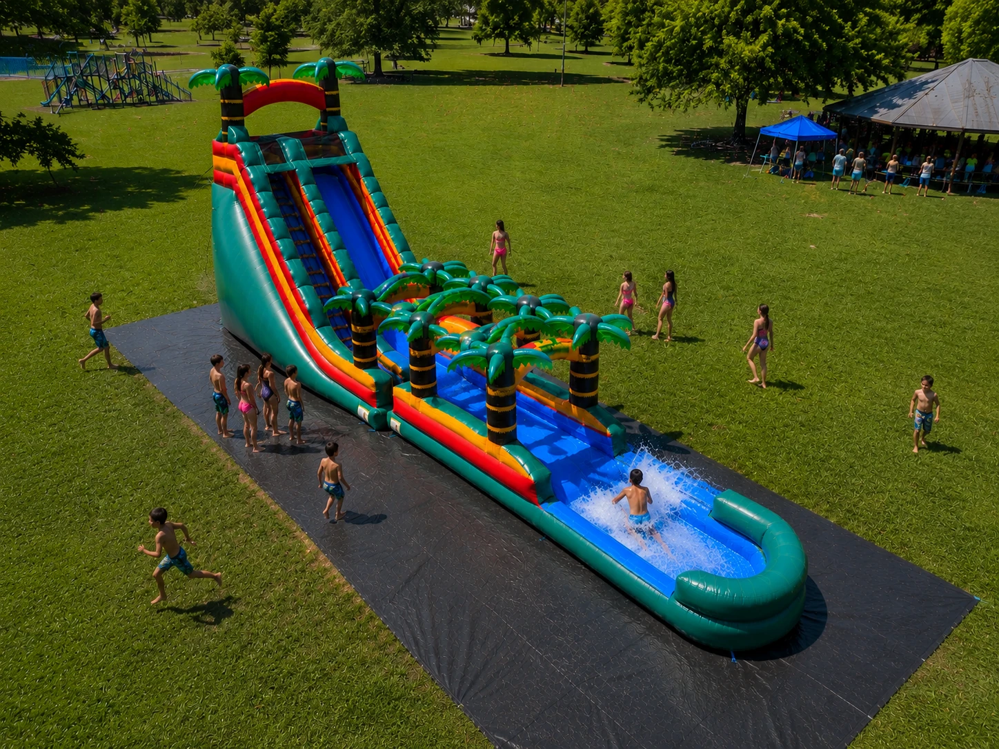 Paradise Falls Ultimate waterslide rental with kids playing at large outdoor event in NC