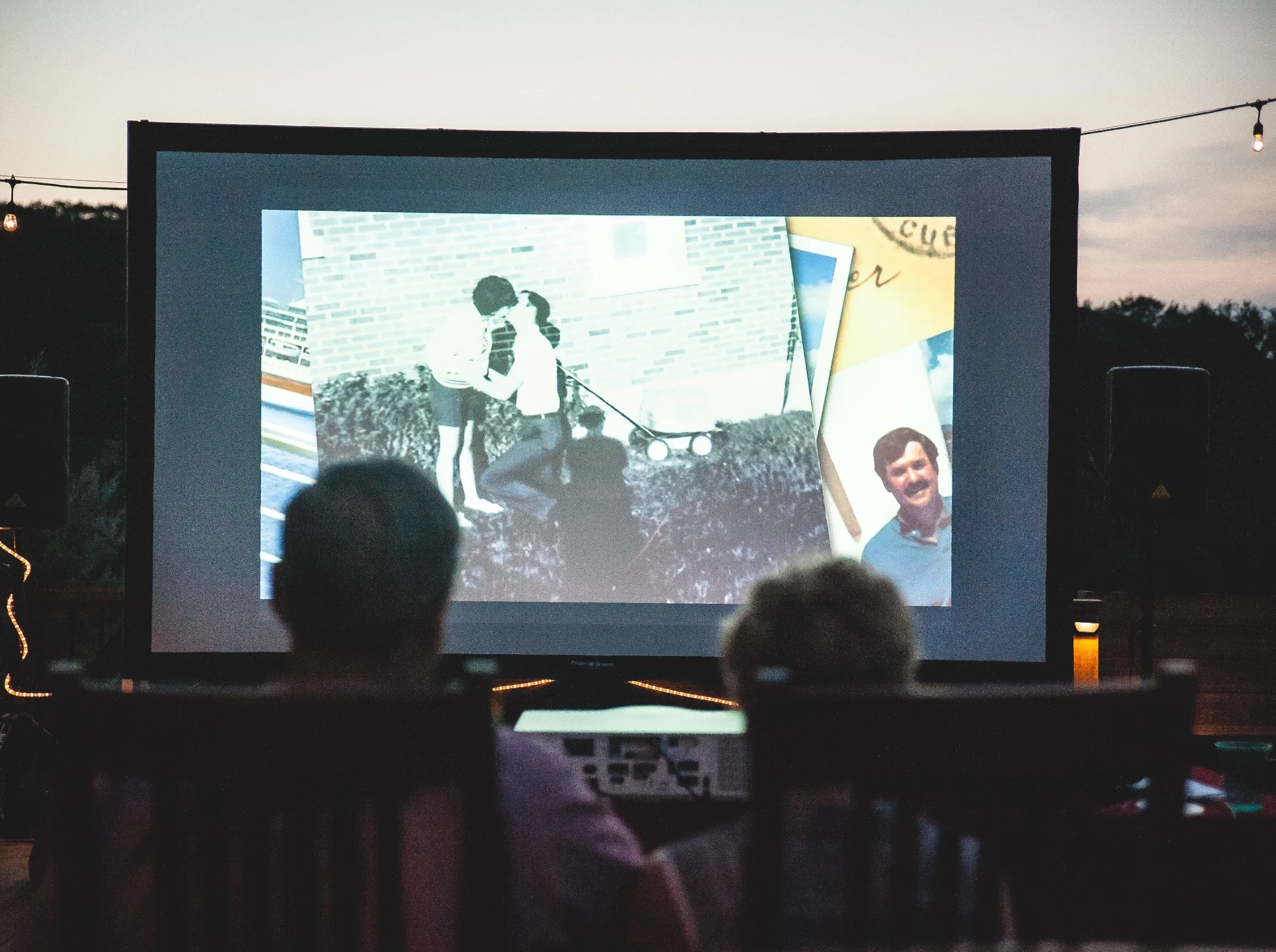 Outdoor movie screen rental in a backyard.