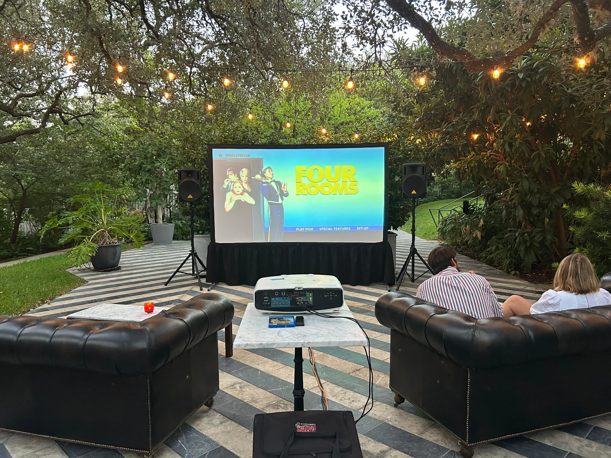 Projector and screen rental for backyard movie nights.