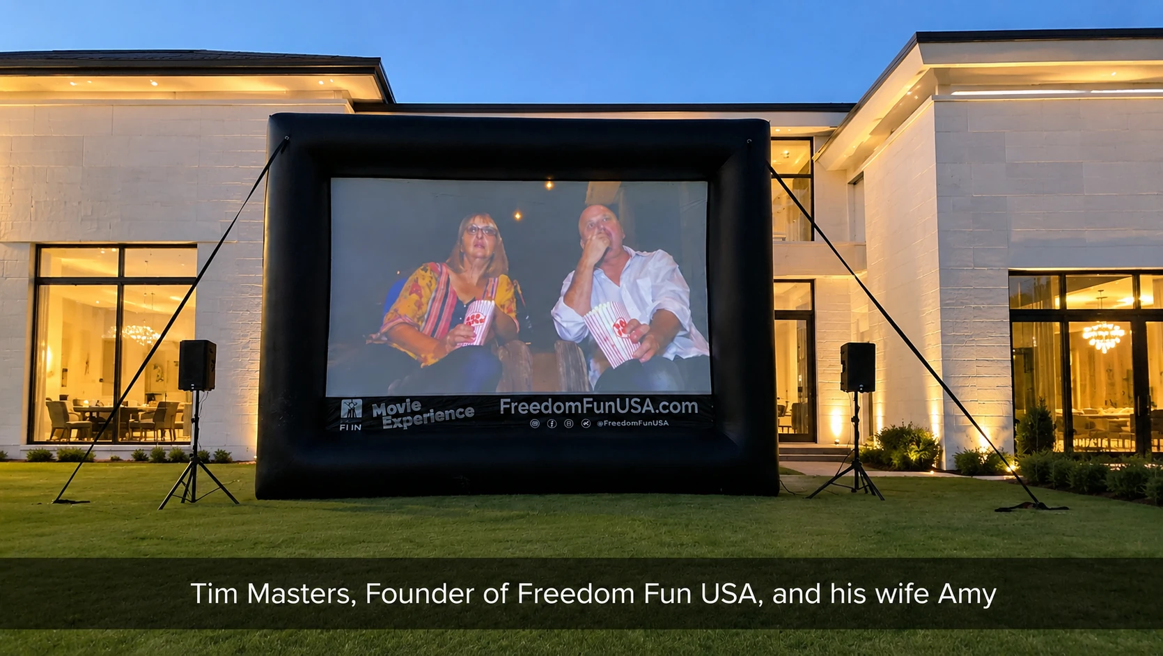 A celebration in the backyard using an inflatable movie screen rental package by the lake. Perfect for backyard movie parties, community movie nights, school events & church parties.