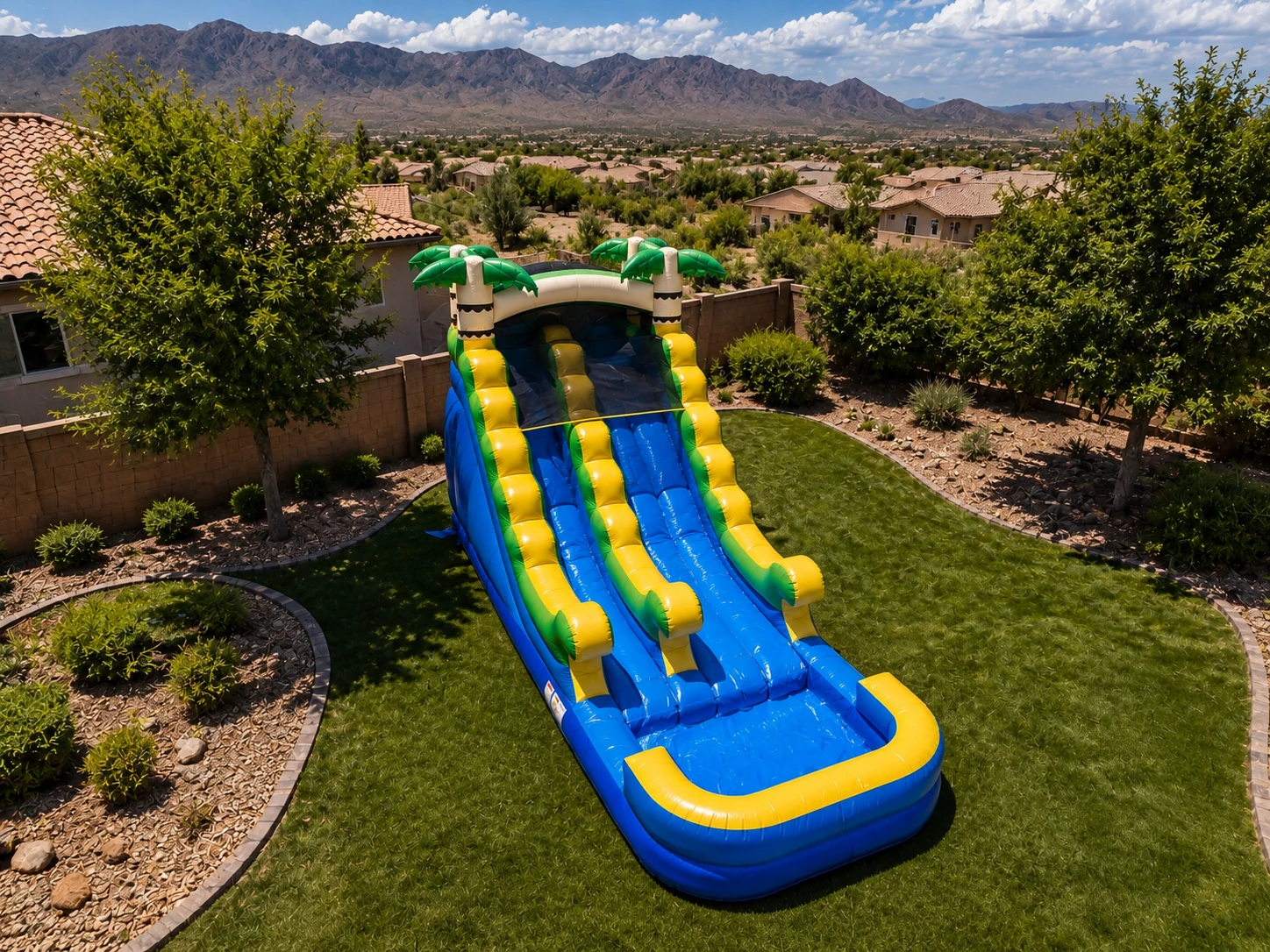 Aerial view of the Freedom Fun Coconut Cove 14' dual-lane waterslide rental in Albuquerque NM