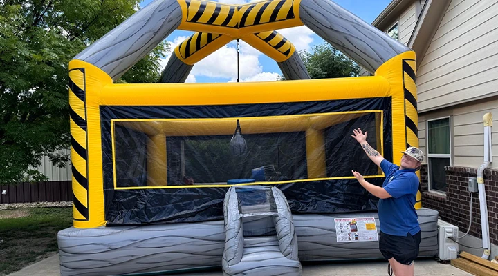 Kids playing inflatable field day games rental.