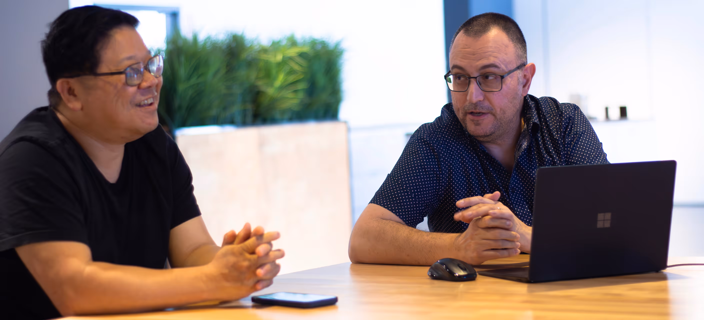 two NowPac employees during a meeting