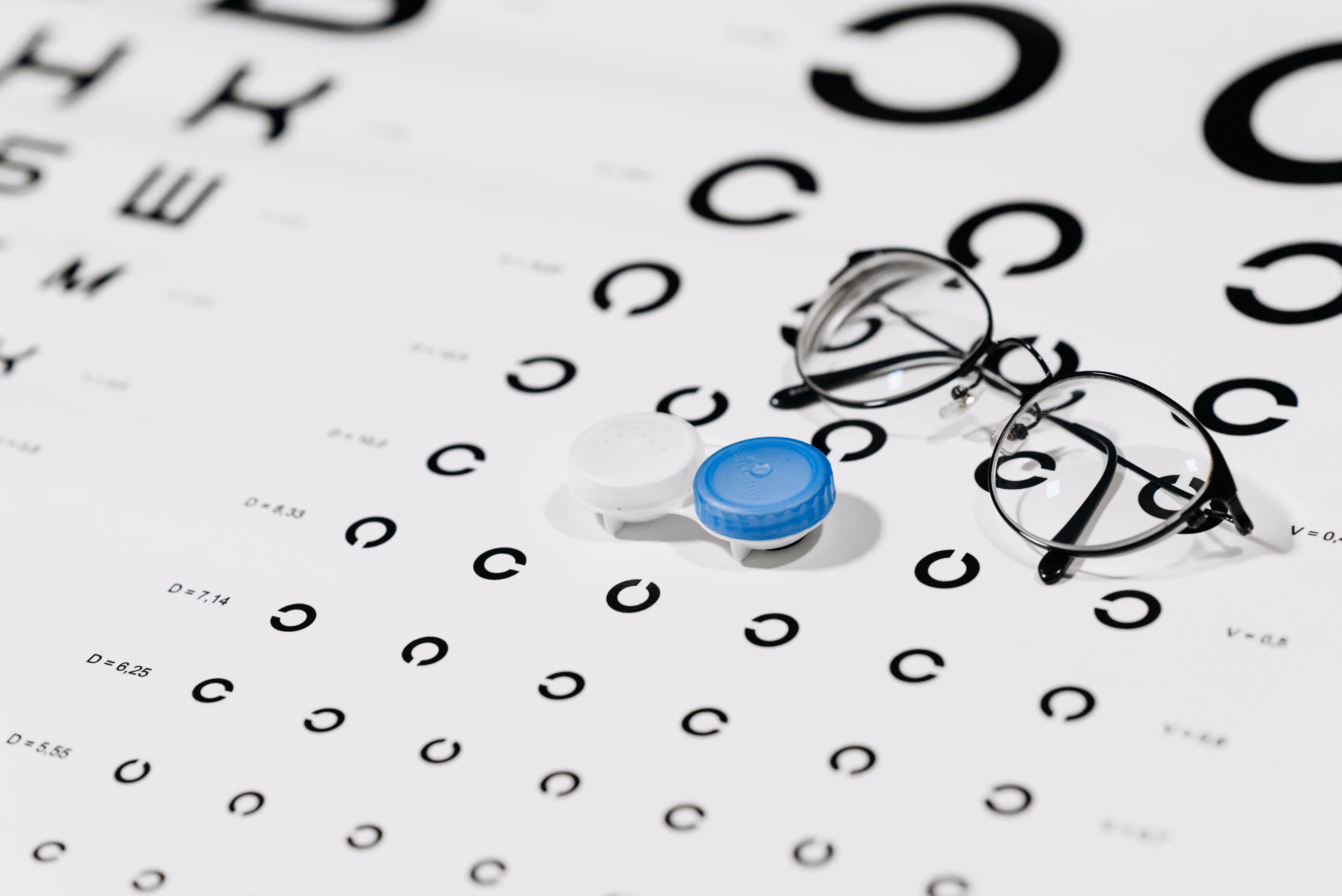 Optometrist helping child with eye exam
