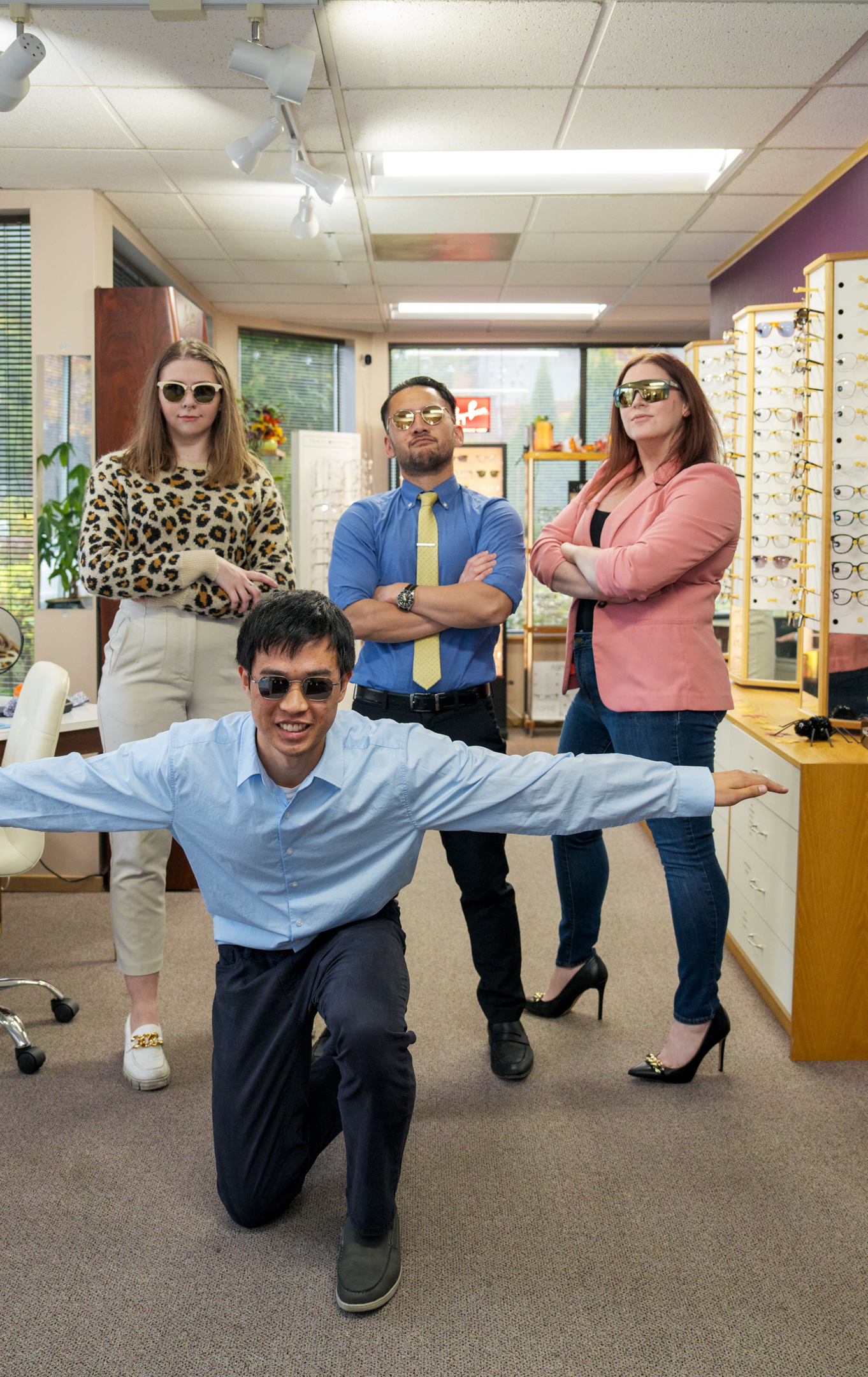 Portrait of Vision Care Center team wearing Maui Jim sunglasses