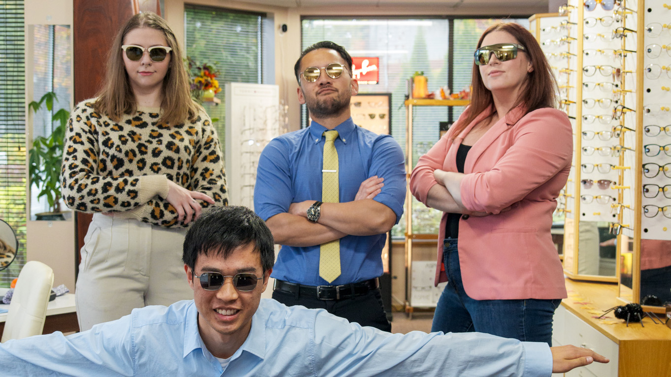 Portrait of Vision Care Center team wearing Maui Jim sunglasses
