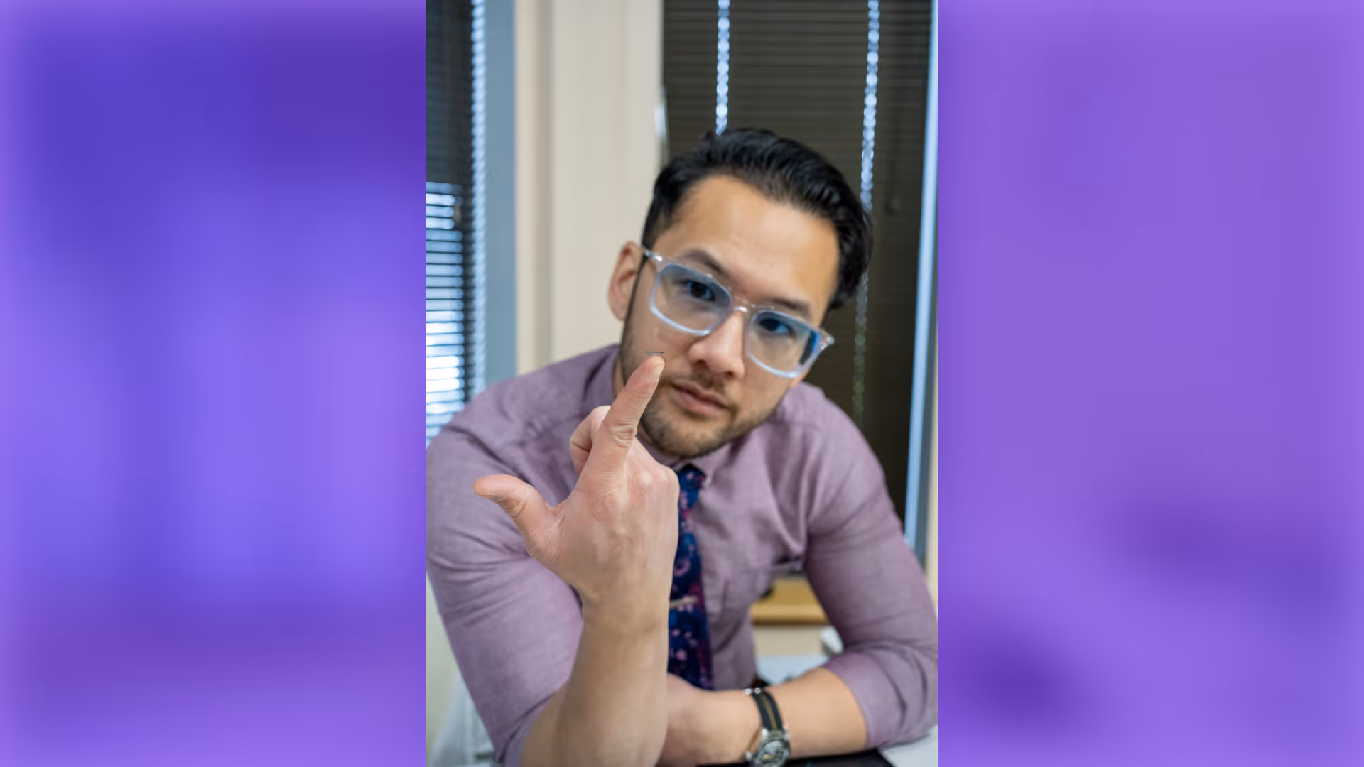 A close-up of a contact lens resting on Dr. Jin's fingertip in Vision Care Center clinic