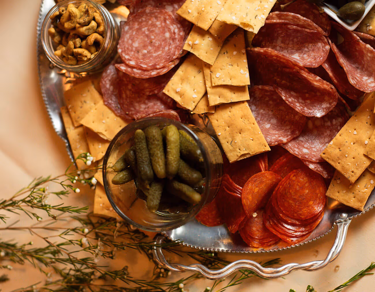 varied starter of sausages, nuts, vegetables and crackers - function space concept