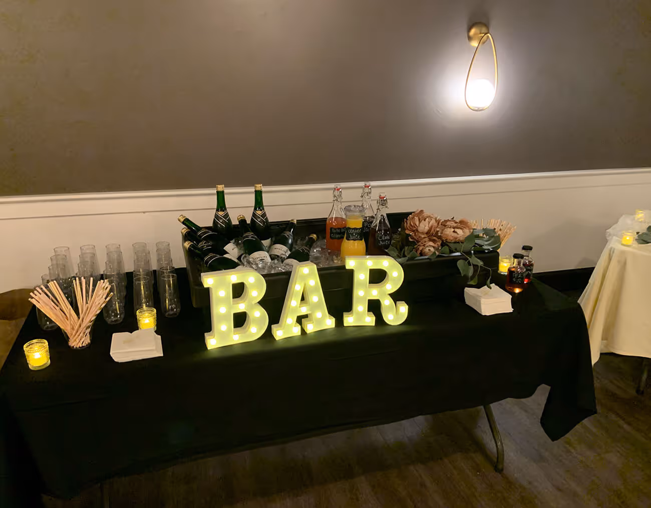 served drinks table, with illuminated bar sign - function space concept
