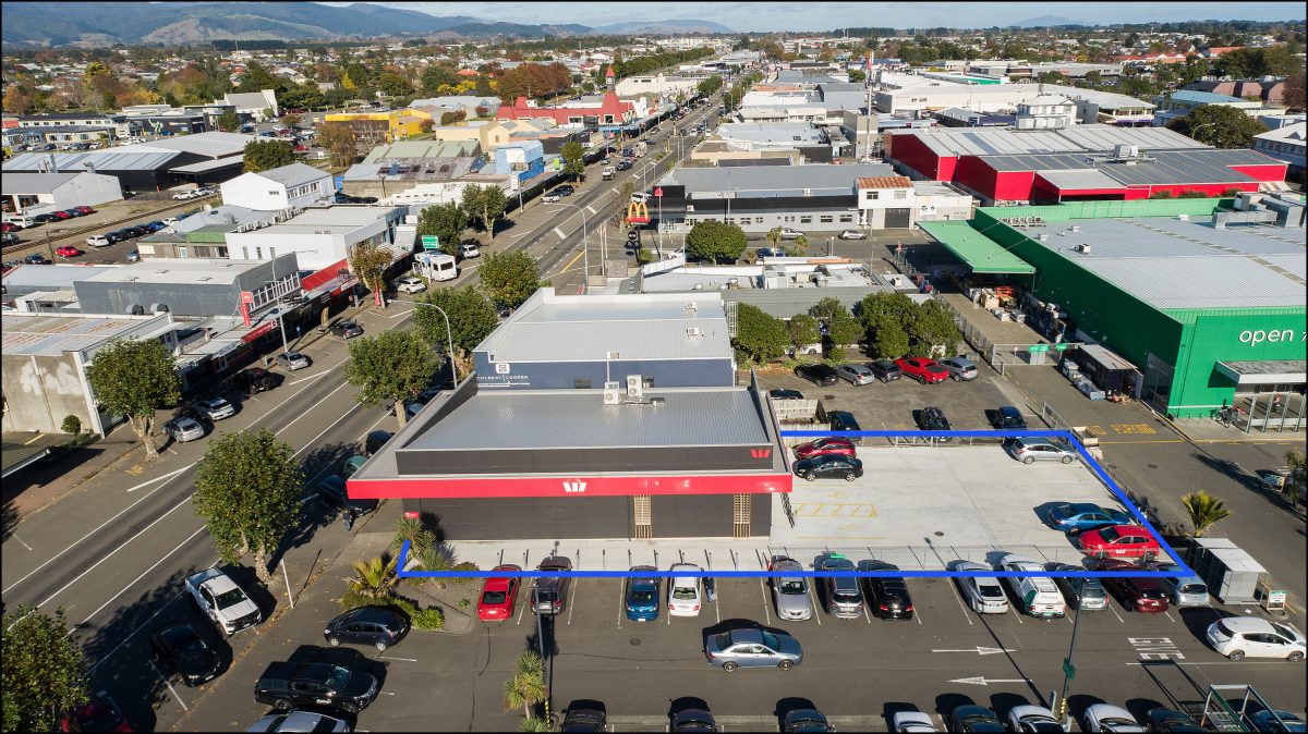 Aerial view of the property and onsite parking