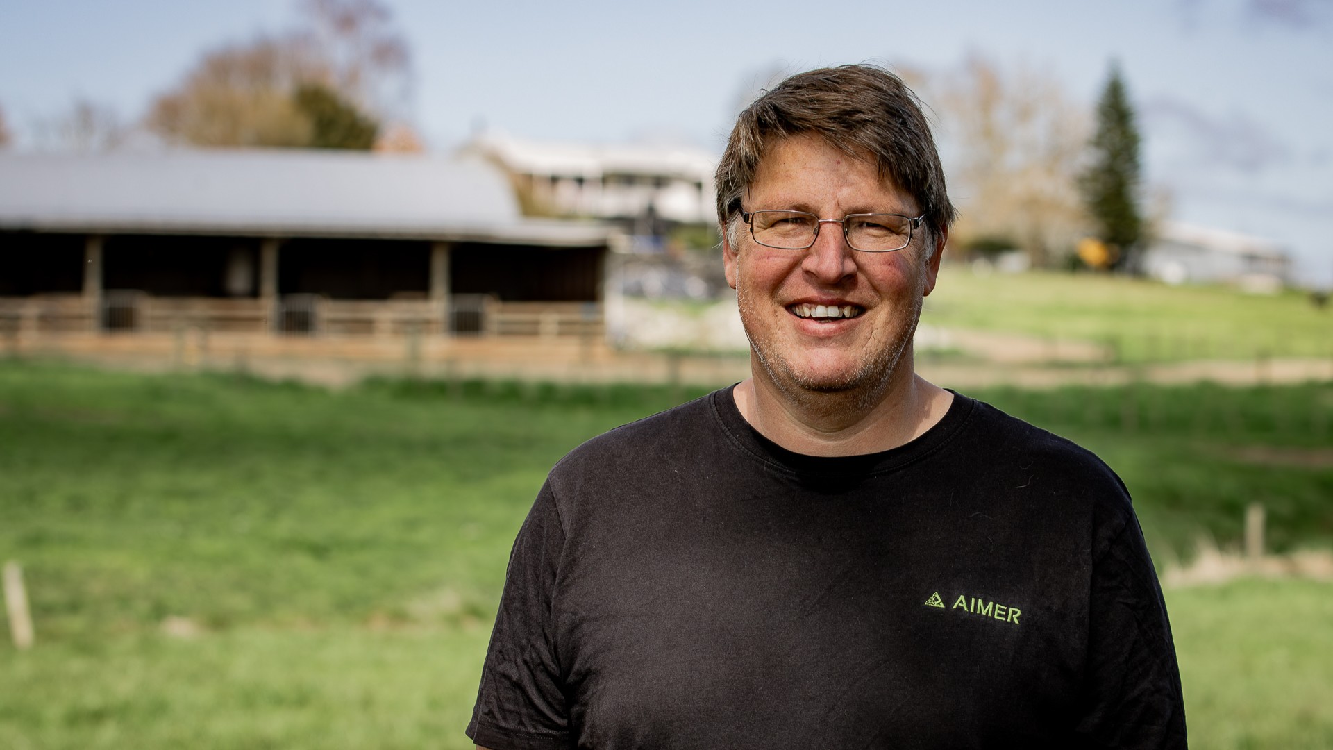 A man using AIMER Vision to scan pasture