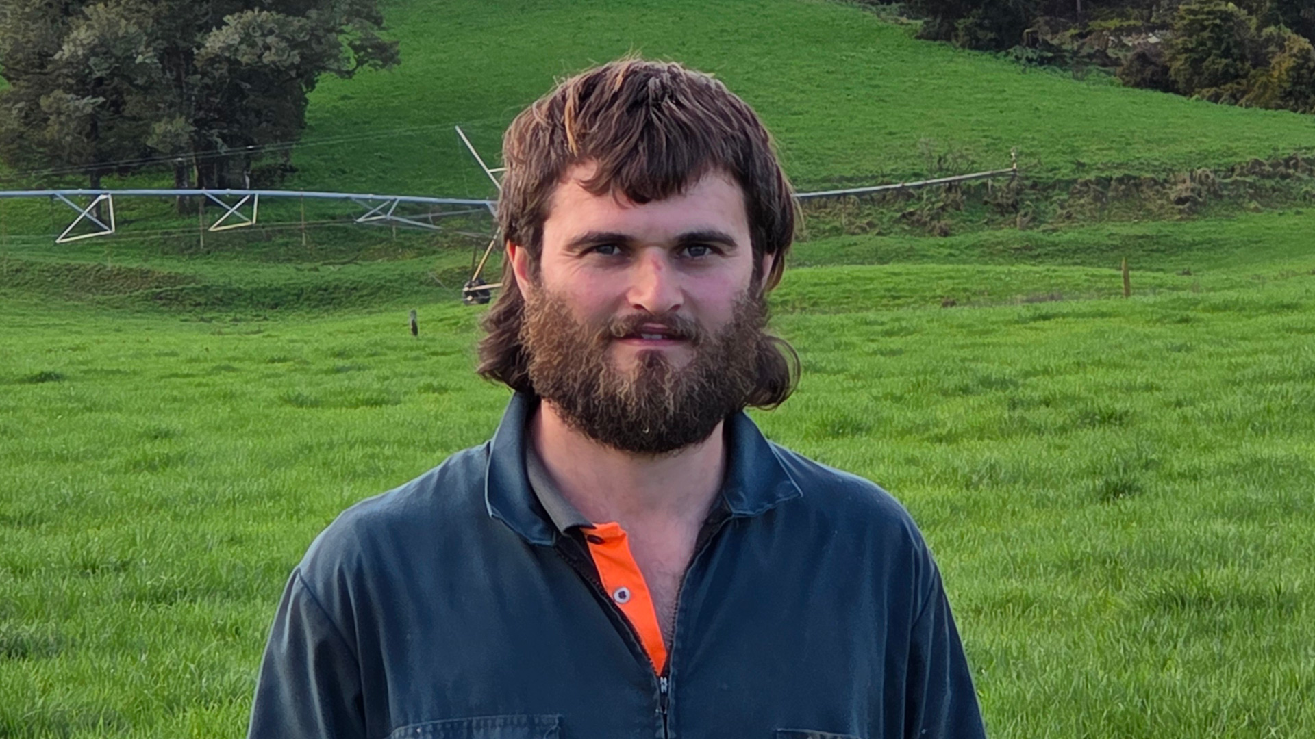A man using AIMER Vision to scan pasture