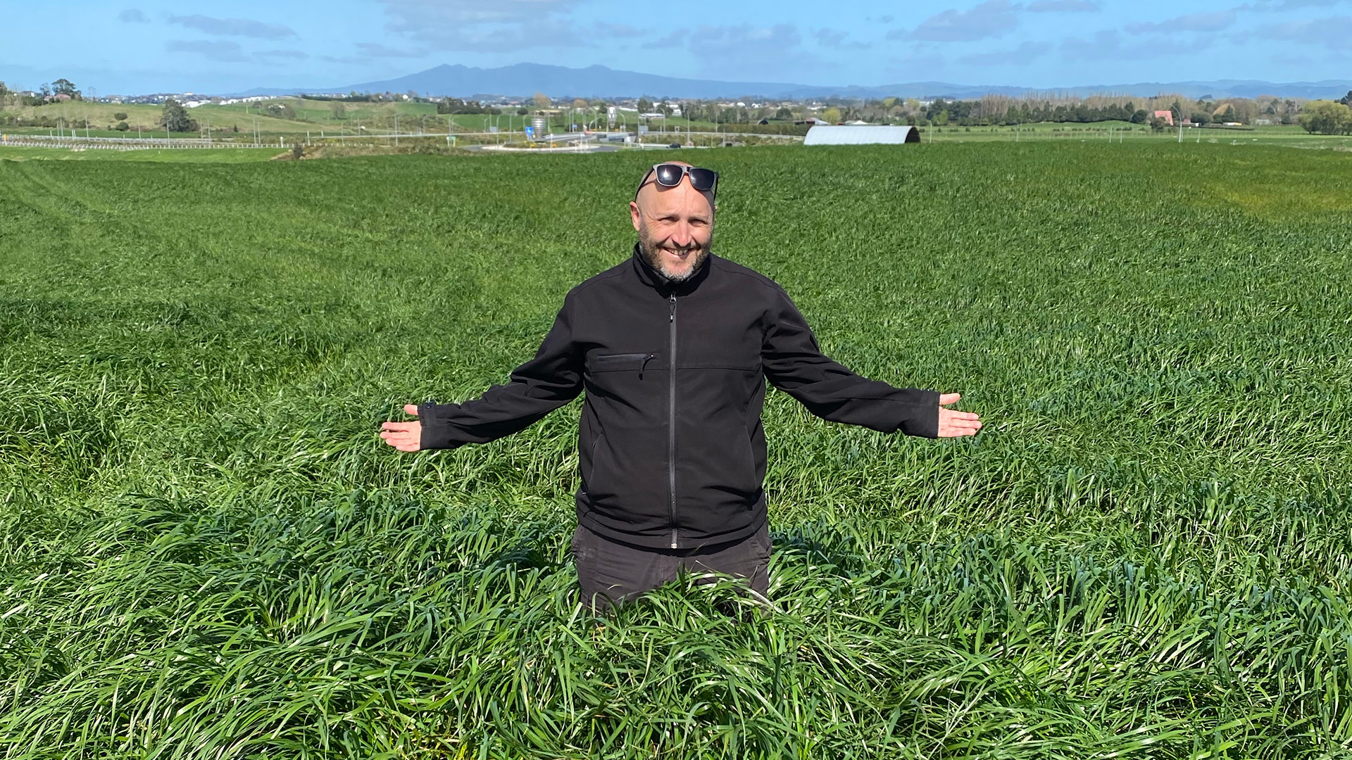 A man using AIMER Vision to scan pasture
