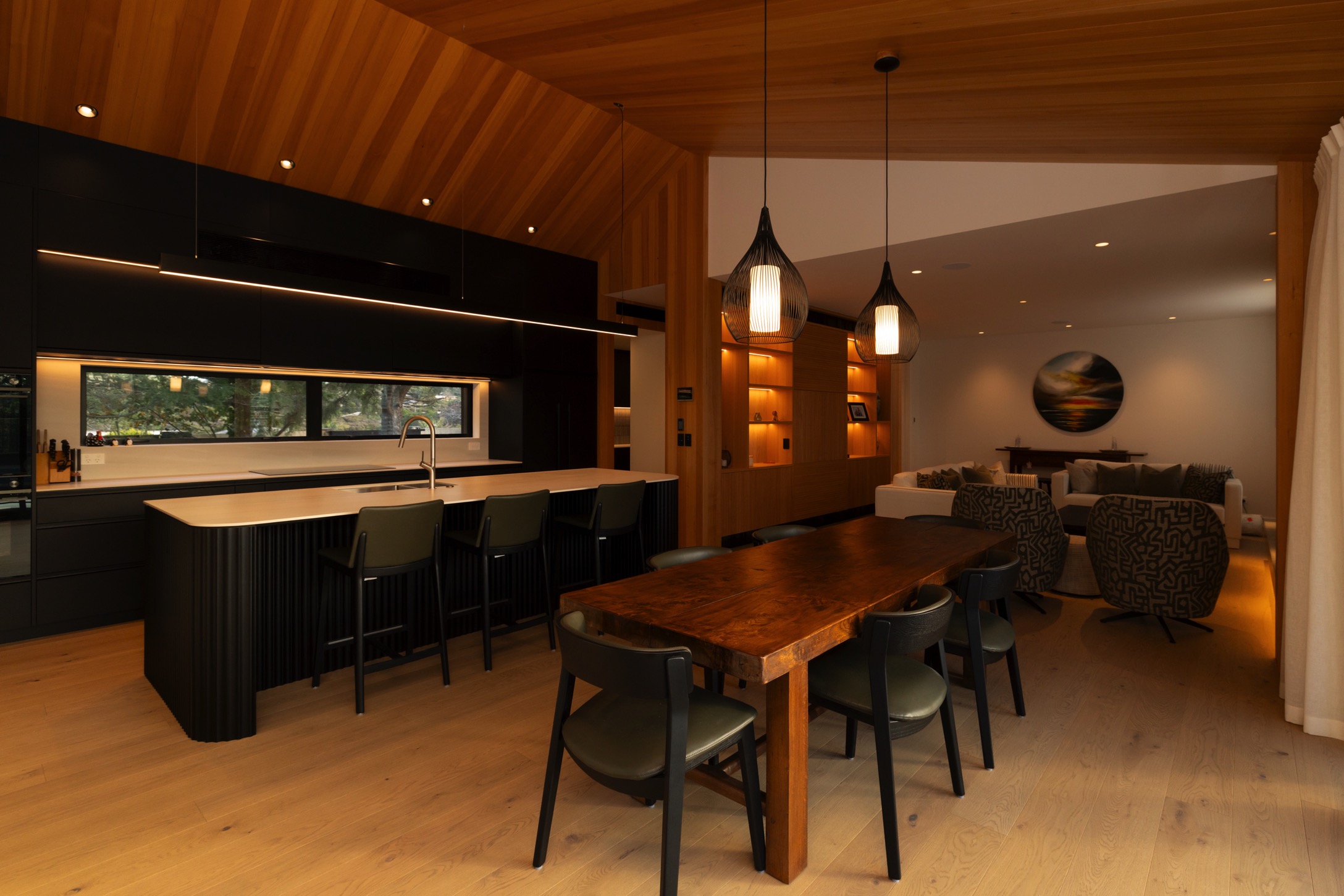 Open Plan modern living, dining & kitchen area with LED lighting installed to cabinetry 