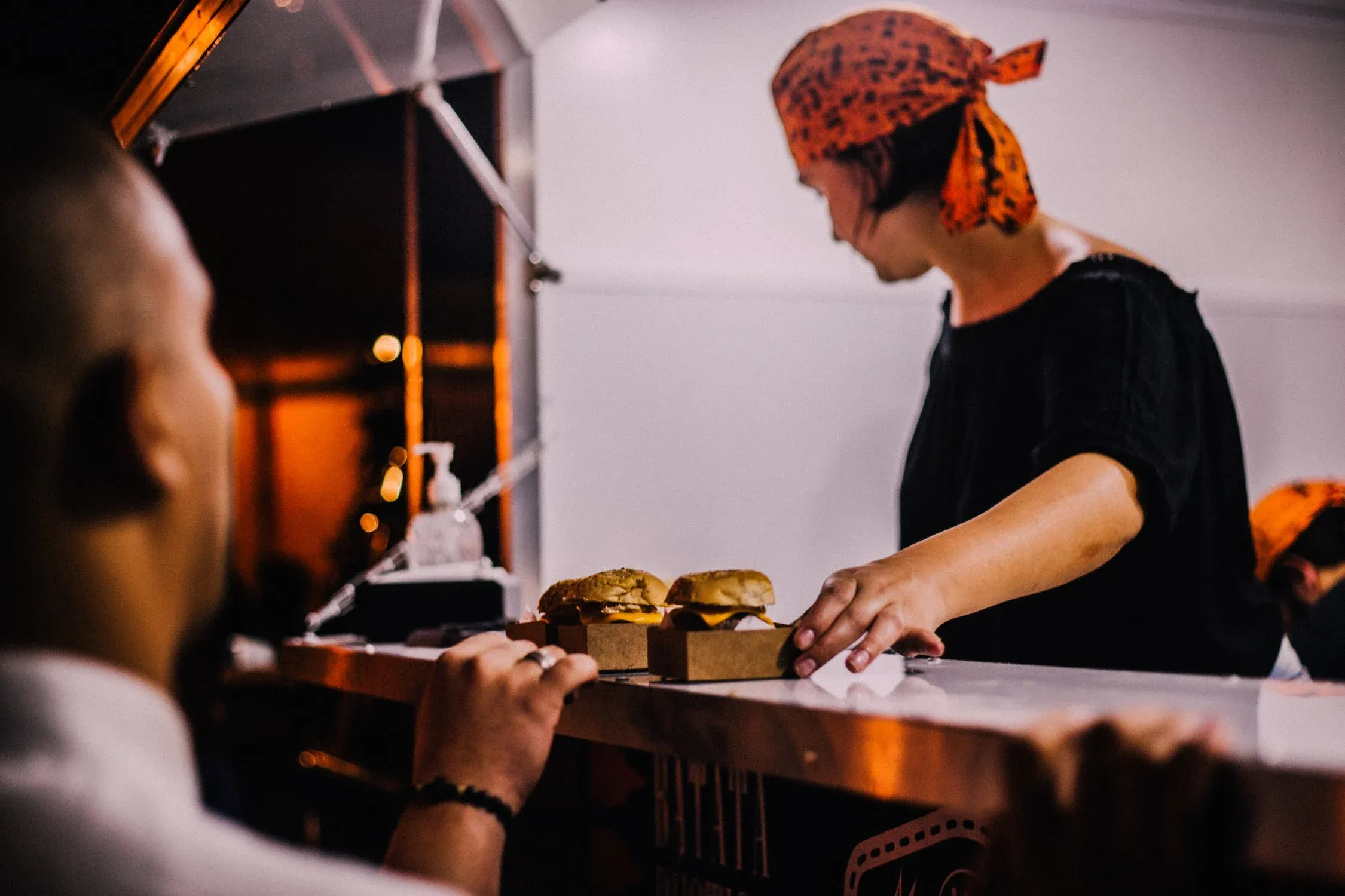An image of a person being attended to in a restaurant