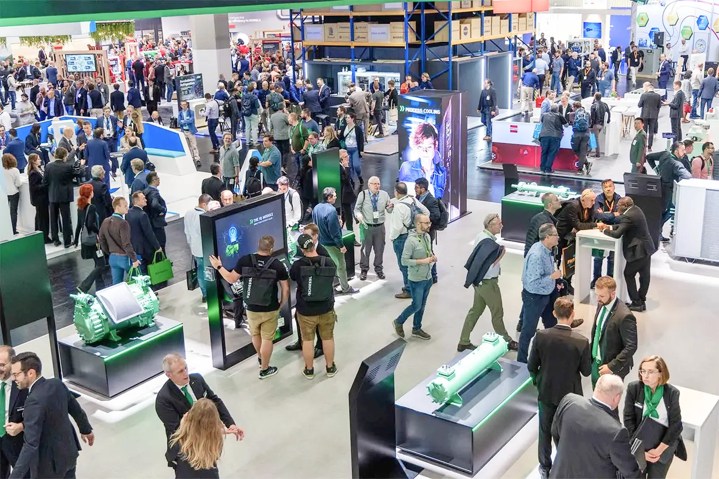 Crowd of people attending Chillventa with machinery and technology displays.