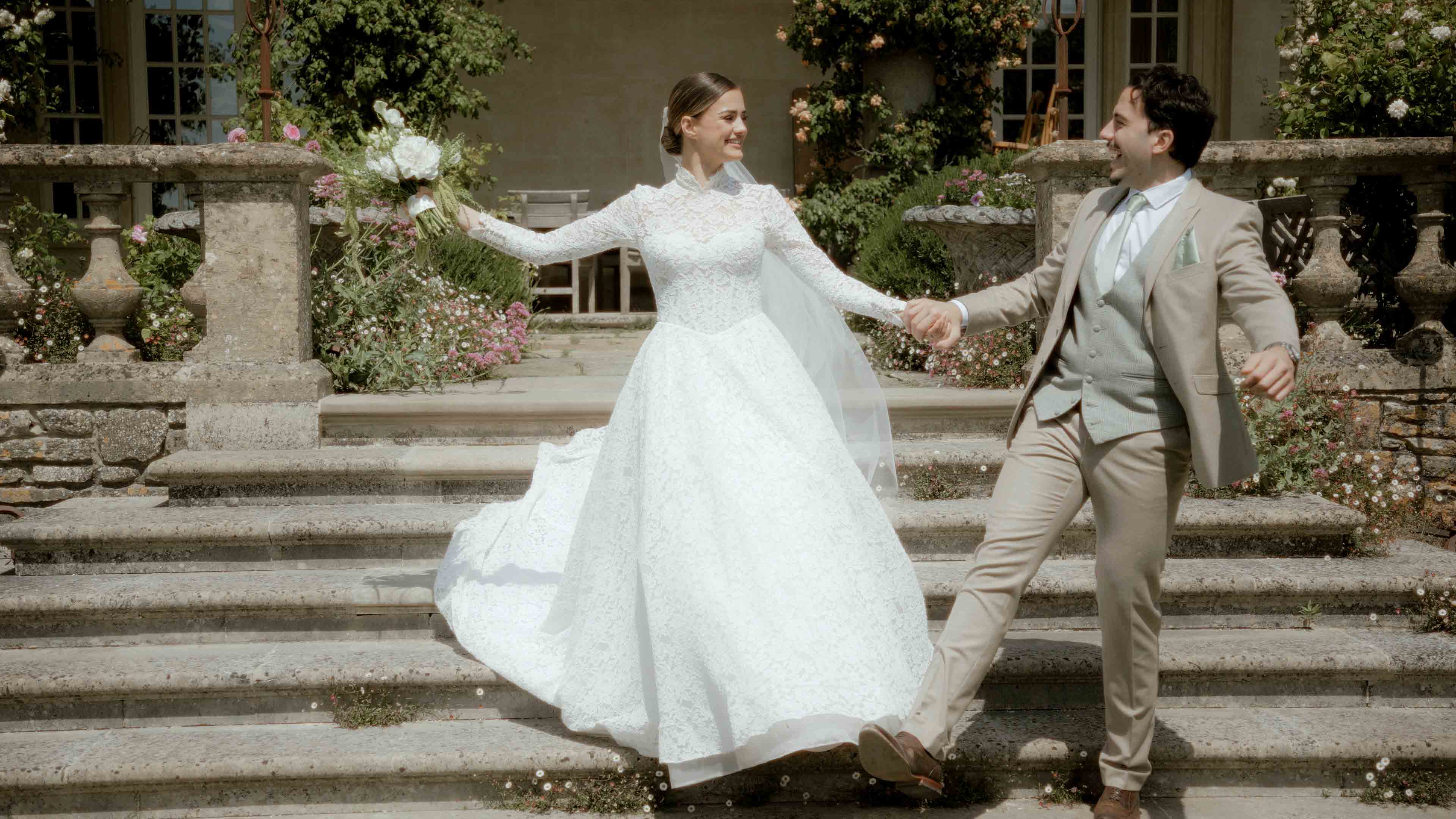 bride and groom walking down steps