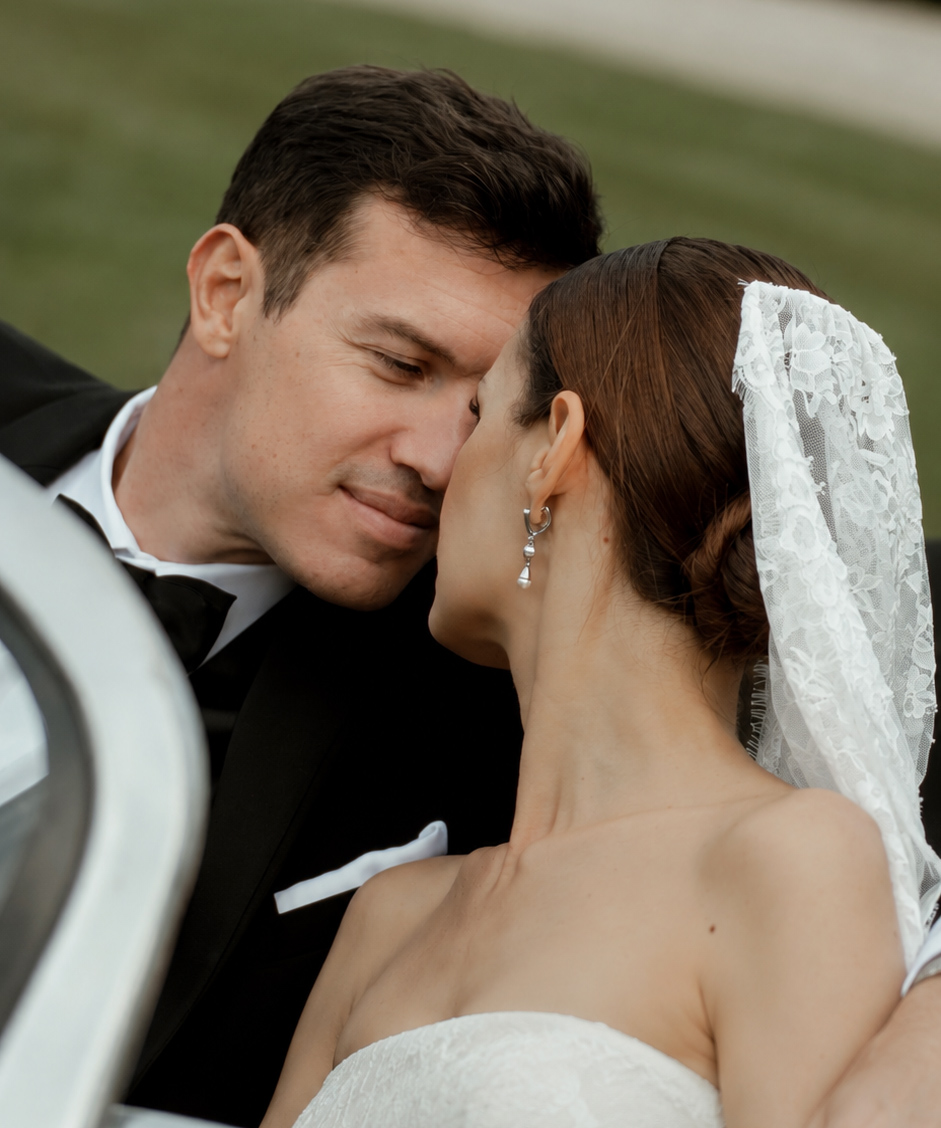 bride and groom in vintage car