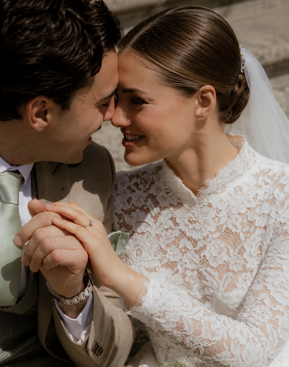 bride and groom share a moment on the steps