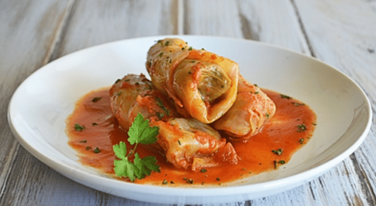 Cabbage rolls on a plate in tomato sauce