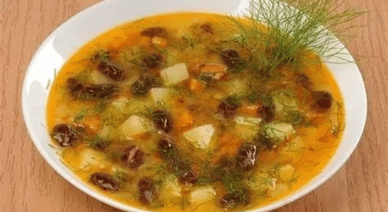 A bowl of Ukrainian bean soup garnished with fresh dill.