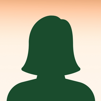 Stilleven van een groene silhouetkop van een vrouw tegen een achtergrond van zachte oranje naar beige verloop.