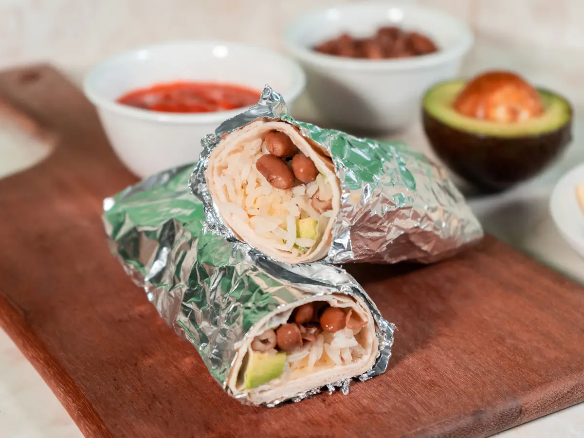 A burrito wrapped in aluminum foil