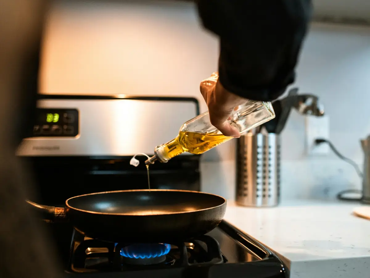 Cooking oil being poured into a pan