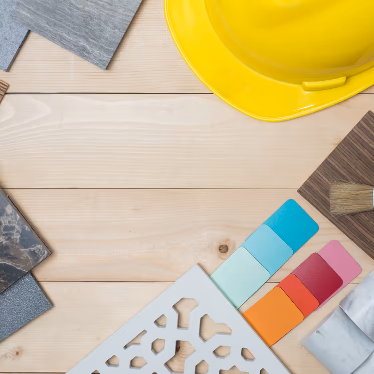 Construction materials and finishes laid out on a table for project planning.