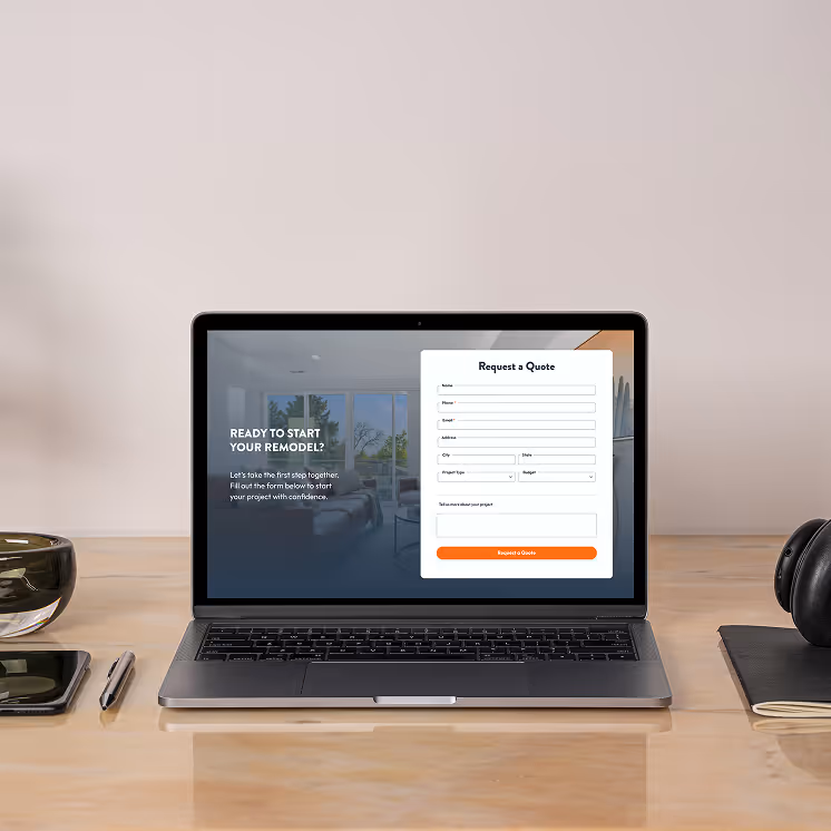 Laptop on a table displaying the Bunny Hill Builds site form.
